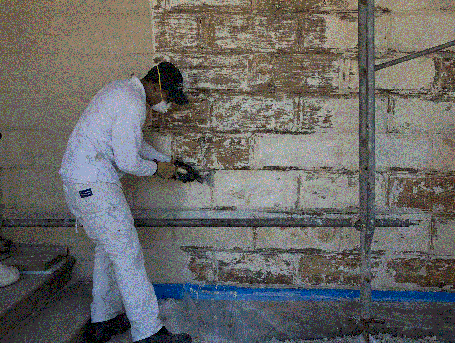 Scraping paint from the west front, MVLA.